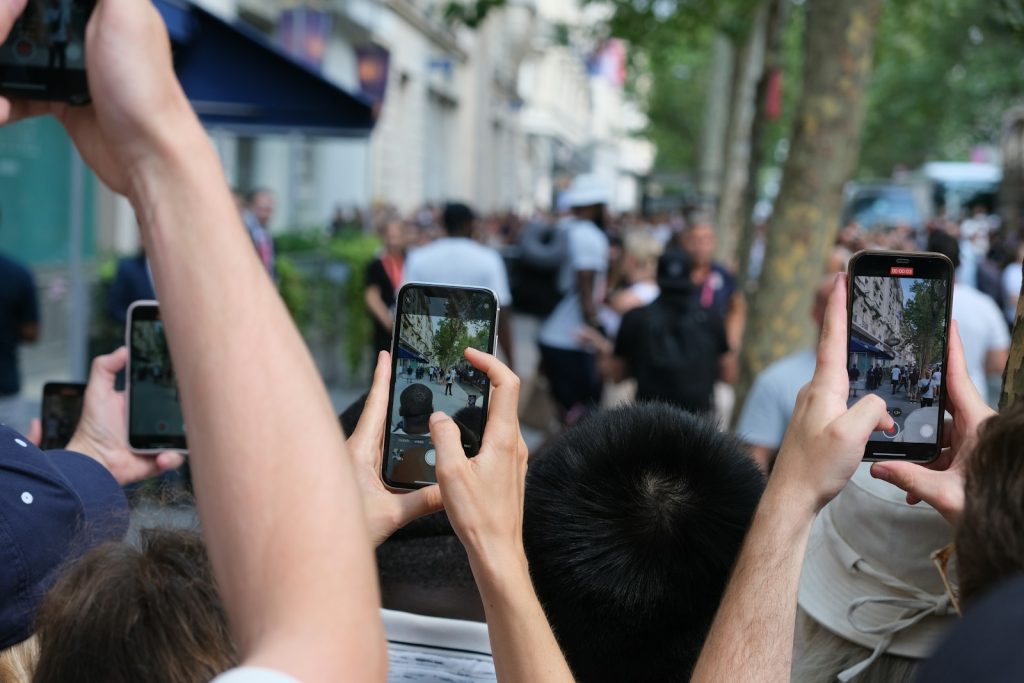 Paparazzi taking photos of a celebrity event